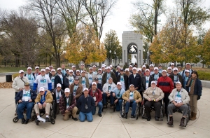 Jeremy Hogan | Herald-Times  Bloomington area World War II Veterans and their guardians pose for a group photo at the entrance to the WWII memorial in Washington, D.C.